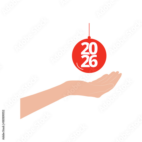 Hand holding a christmas ball ornament with 2026 number inside isolated on a white background