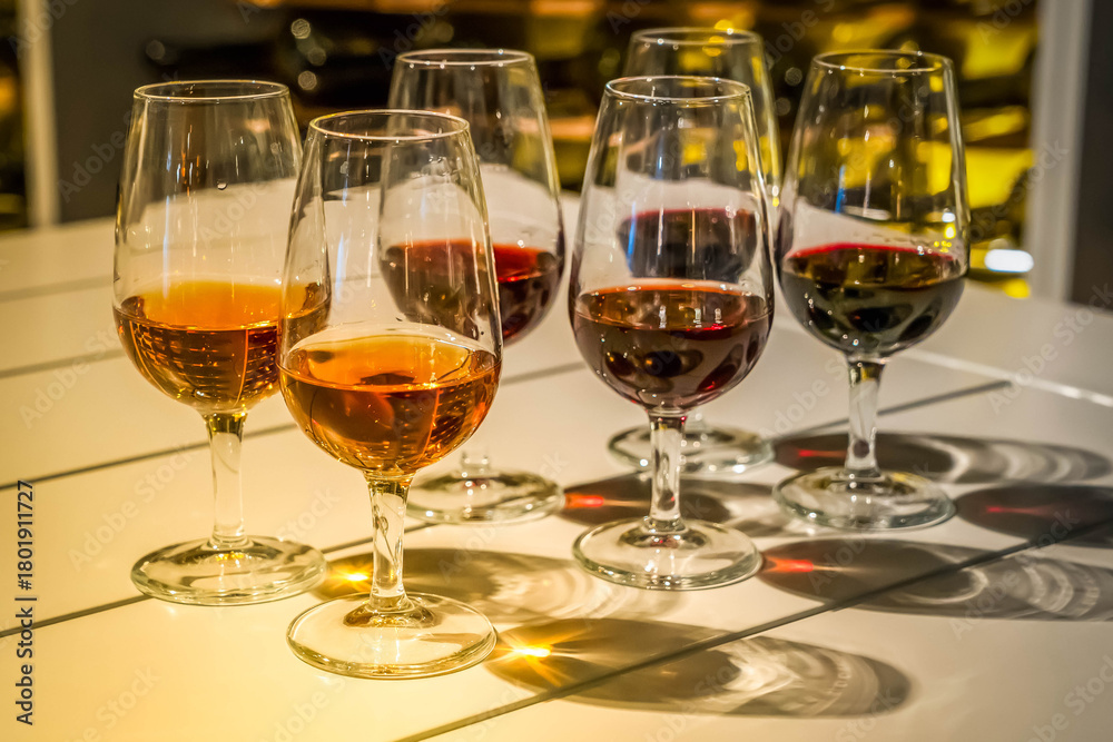 Obraz premium port wine testing, glasses with drink - white and red