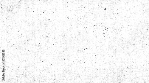 Subtle grey speckled texture background with a distressed canvas feel and scattered dark dots white