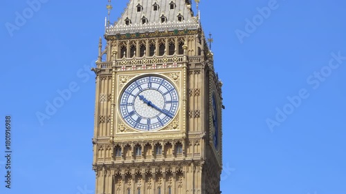 Close-up of Big Ben clock face under bright sunlight in London on a sunny day