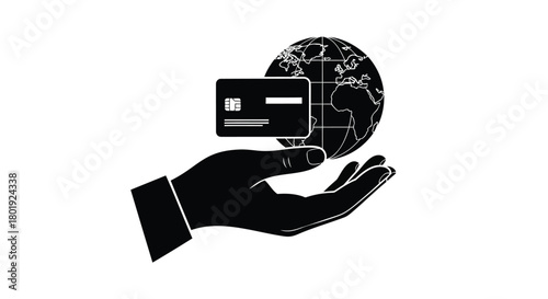 Silhouette of a hand holding a credit card and a stylized globe representing global commerce and financial transactions