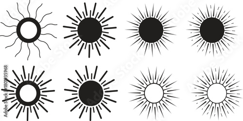 Collection of stylized sunbursts and rays in black and white
