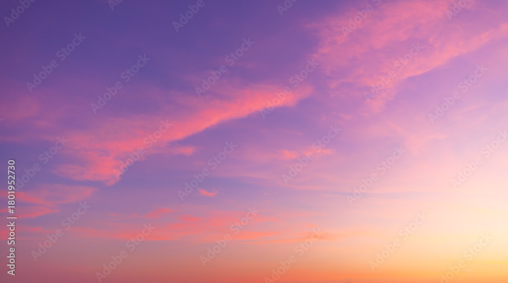 Obraz premium Clouds and sky backdrop at sunset and sunrise,Sunset Sky Clouds in the evening with Red, Orange, Yellow and purple sunlight on Golden hour after sundown, Romantic sky in summer on Dusk Twilight 