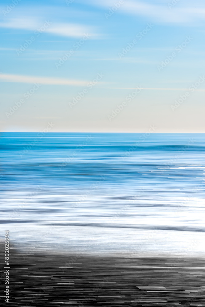 Fototapeta premium Reynisfjara Beach: Iceland’s striking black sand and basalt columns meet the roaring Atlantic