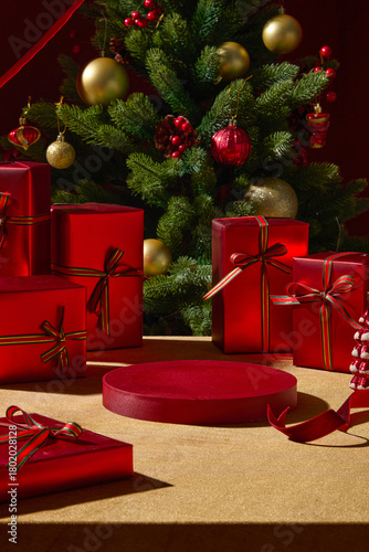 A wooden table with red holiday gifts and a Christmas tree behind them. The decorations and warm tones create a joyful holiday atmosphere suitable for Christmas visuals.