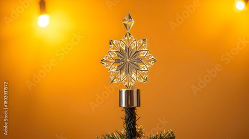 Crystal Christmas tree topper glowing under warm lights