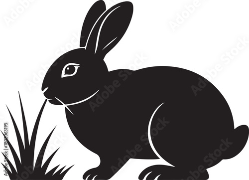 Black silhouette of a rabbit eating grass on a white background
