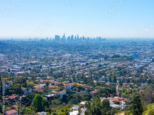 Hazy, wide panoramic view of the Los Angeles downtown skyline.