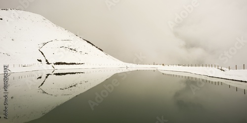 Onset of winter in May, Riezler Alpsee, an artificial lake, snow pond, feeds the snow cannons that provide the slopes of the Fellhorn and Kanzelwand cable cars with snow, Allgäu Alps, Vorarlberg, Austria