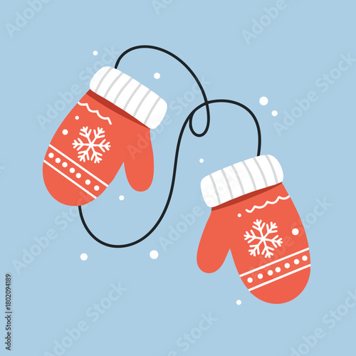 Red mittens connected by a string, perfect winter accessory for cold days and holiday celebrations 
