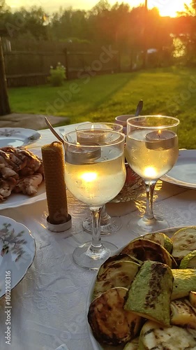Romantic dinner outdoors on sunset. 