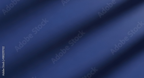 Navy blue fabric presents a smooth abstract background with subtle light and shadow creating an elegant texture perfect for graphic design projects adding depth and sophistication to any visual prese