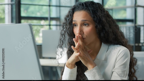 Worried confused Hispanic business woman reading bad news on computer puzzled with online work task businesswoman ethnic female girl worker manager with pc difficulty working feeling stressed error