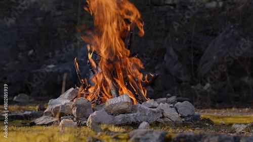 Beautiful Crackling Campfire in a Rocky Landscape among the Pines, Sunrise , ...