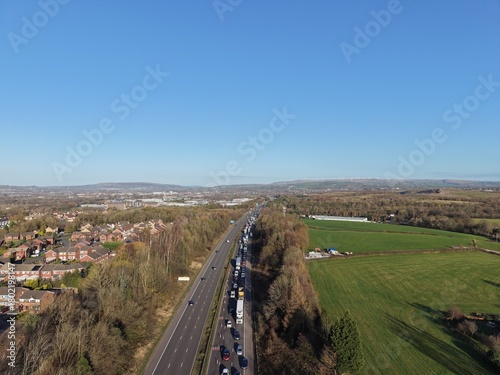Aerial view of busy traffic on a motorway in greater Manchester  with lane closures. Bury Manchester England. 