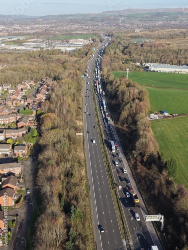 Aerial view of busy traffic on a motorway in greater Manchester  with lane closures. Bury Manchester England. 