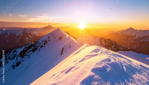 A breathtaking sunrise illuminates a vast mountain range covered in snow, casting long shadows and creating a vibrant sky.