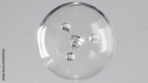The process of molecule formation inside a transparent sphere. Abstract animation for cosmetic product advertising with a transparent texture.