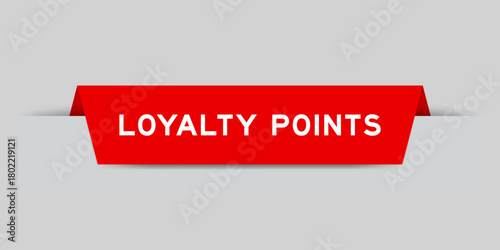 Red color inserted label with word loyalty points on gray background