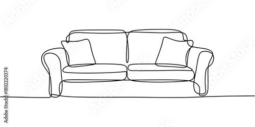 a two-seater sofa with pillows, symbolizing home comfort, furniture design, interior decor, and relaxation.