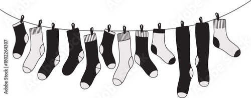 Assorted socks hanging on a clothesline black and white vector