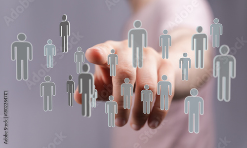 Hand pointing at a group of...