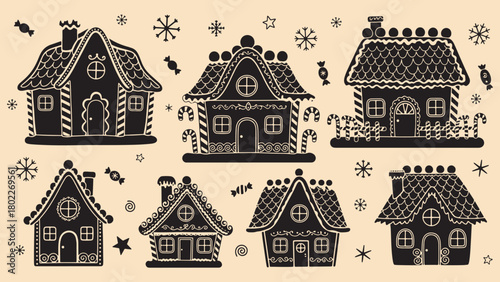 Decorative gingerbread houses with candy and snowflakes on light background