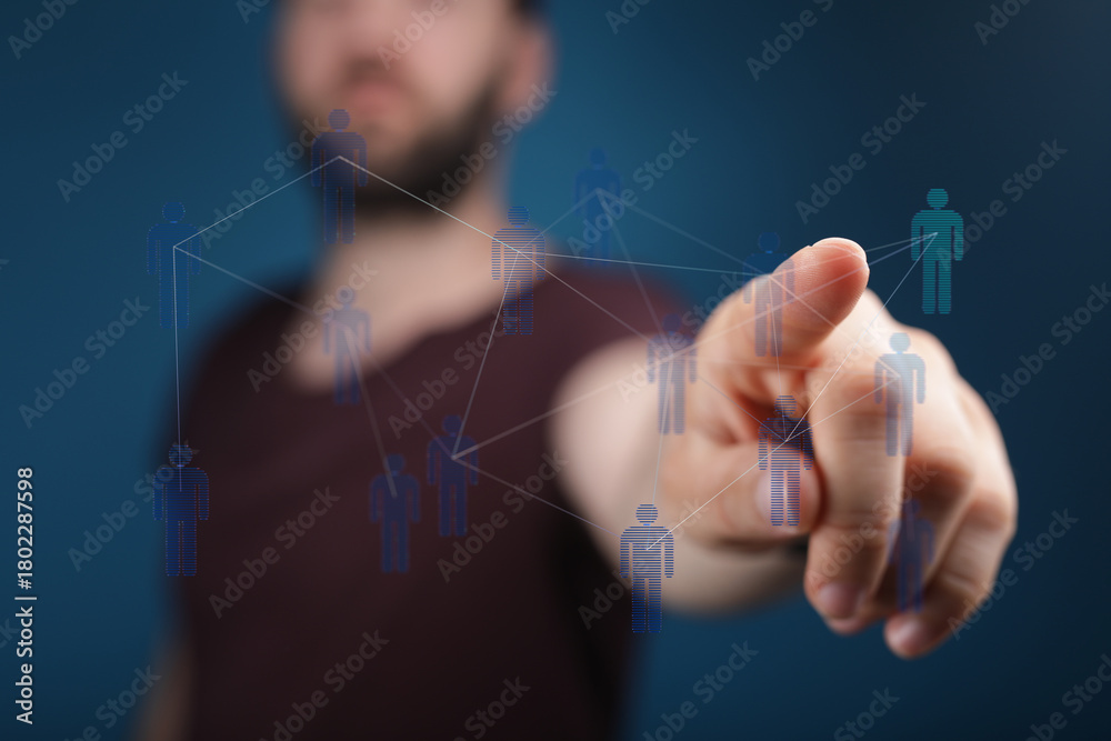 Fototapeta premium Hand pointing at a network of people. Symbol of connection, communication, social media, and collaboration. Mod