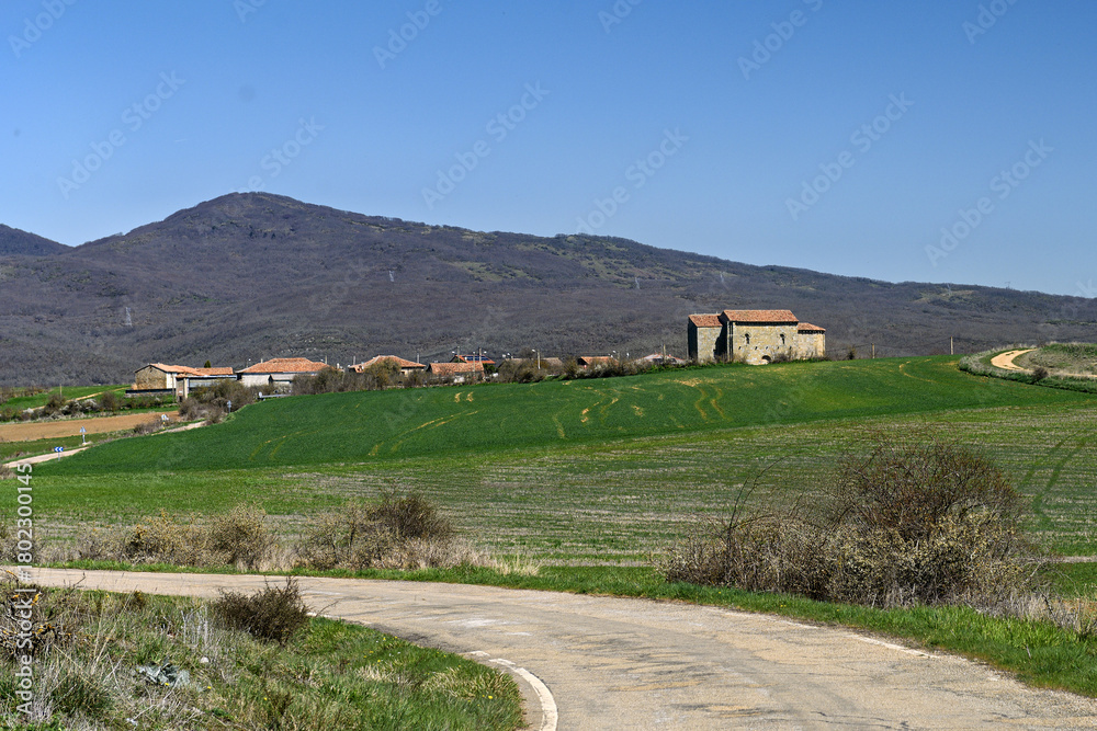 Obraz premium Scenic view of San Martin church in Matalbaniega with hills and countryside background