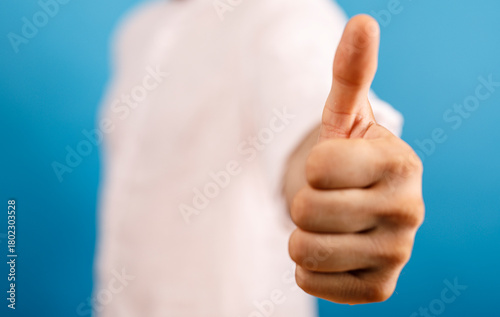 Image of a hand giving a th...