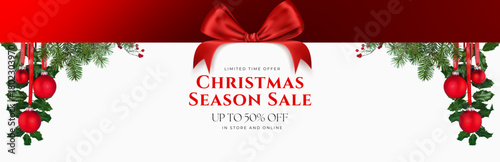 Christmas season sale announcement with red ribbon and baubles on white background