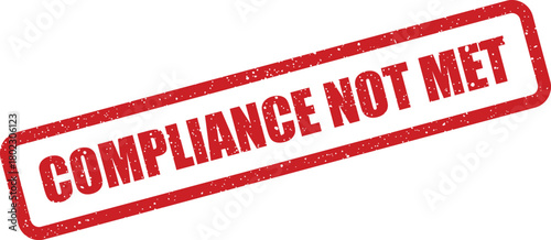 A bold red rectangular rubber stamp indicating COMPLIANCE NOT MET clearly displayed on a pristine white surface