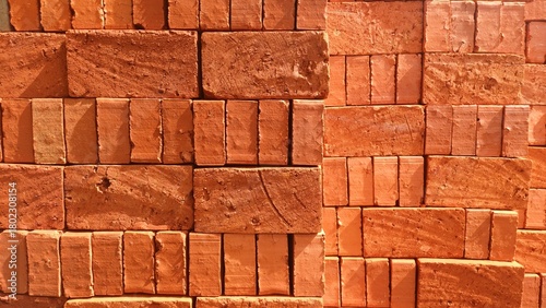 Vászonkép Brick stacks, Bricks pile with their terra cotta color texture background