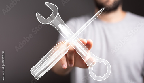 Hand holding digital wrench...