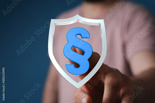 A hand holding a shield wit...