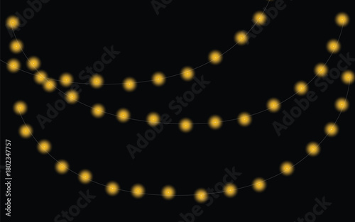 Softly glowing yellow string lights draped in a dark night sky creates a magical ambiance