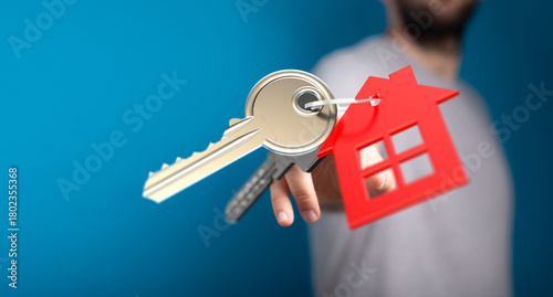 A person holds a key attach...