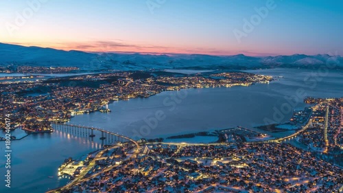 Tromso Norway time lapse day to night city skyline at sentrum harbor view from Fjellheisen observation deck