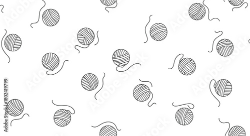 Seamless pattern featuring hand-drawn yarn balls with trailing ends, creating a playful and cozy textile design for crafting and knitting projects.