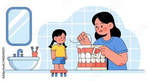 A caring mother teaches her young daughter essential flossing techniques with a dental model in the bathroom, fostering healthy oral hygiene habits and promoting dental care education