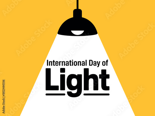 International Day of Light is celebrated with a spotlight illuminating the text.