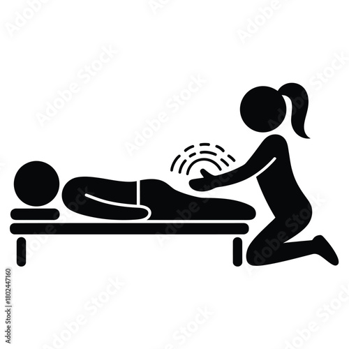 Therapist performing energy healing on a patient