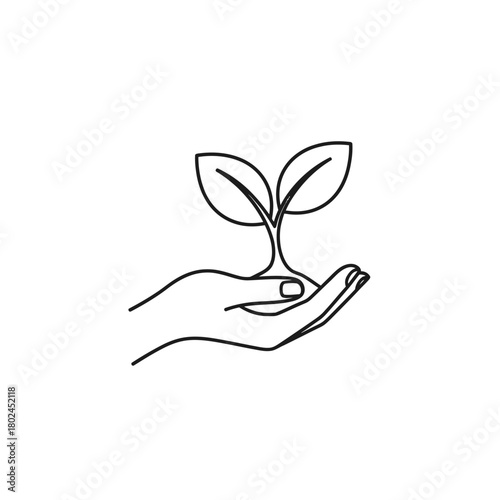 Delicate Hand Gently Holding a Sprouting Plant with Two Leaves.