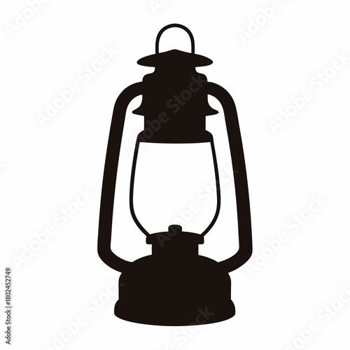 Silhouette of a Vintage Kerosene Lantern Standing on a White Background