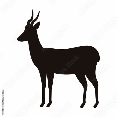 Silhouette of a graceful antelope standing majestically against a white backdrop