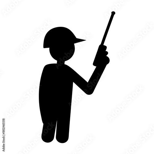 Silhouette of a worker wearing a hard hat and using a walkie talkie