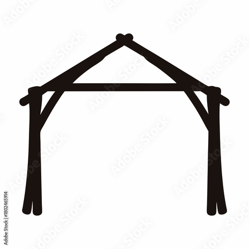 Black silhouette of a wooden stable or nativity scene structure