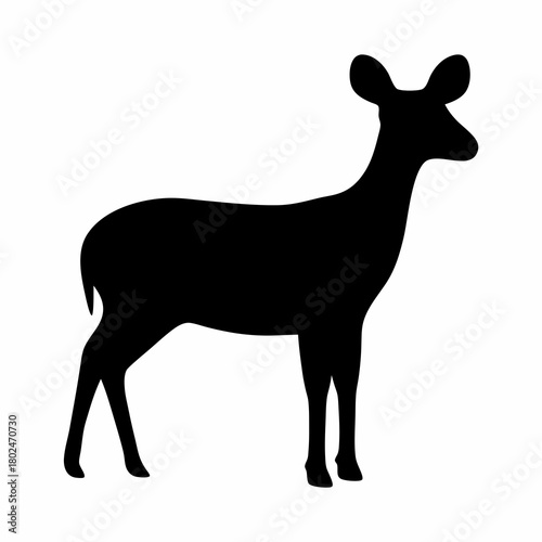 Elegant black silhouette of a graceful deer standing in watchful pose