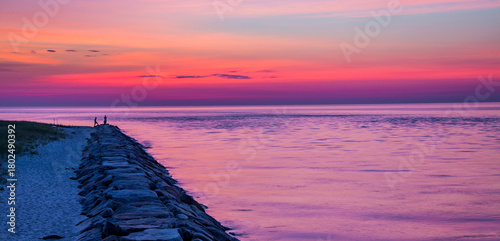 Photos The stone breakwater stretches into the water at dawn in Martha's Vineyard