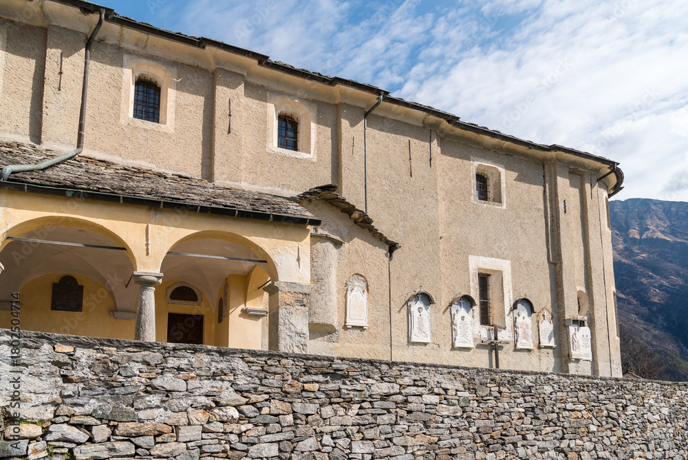 Fototapeta premium View of the Church of Saints Carpoforo and Gottardo located in Mergoscia, a mountain village in the canton of Ticino, Switzerland.